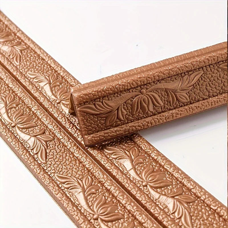 Close-up of brown self-adhesive foam wall trim strips with embossed leaf patterns.