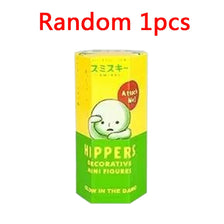 A yellow blind box figure of a white animal character with Japanese text and the brand Hippers