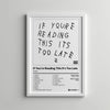 A framed print featuring the text If You're Reading This It's Too Late in a handwritten style on white paper.