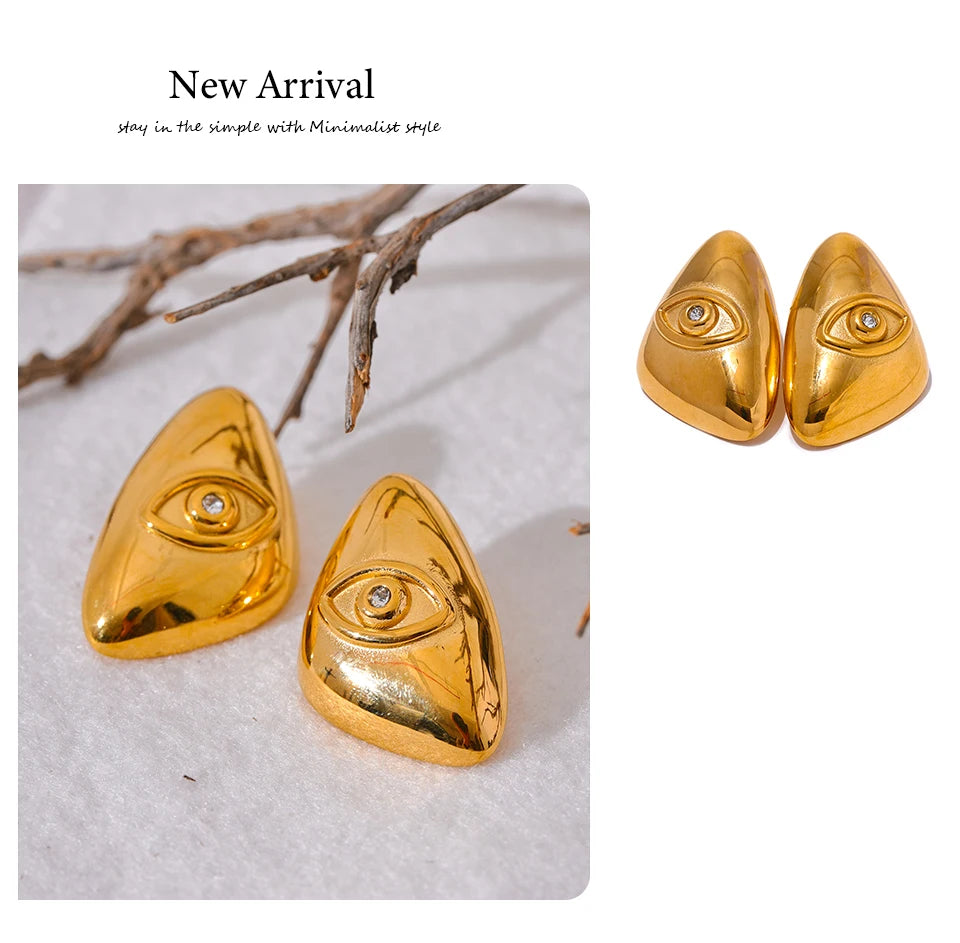 Gold-toned geometric stud earrings shaped like eyes, displayed on a white background.