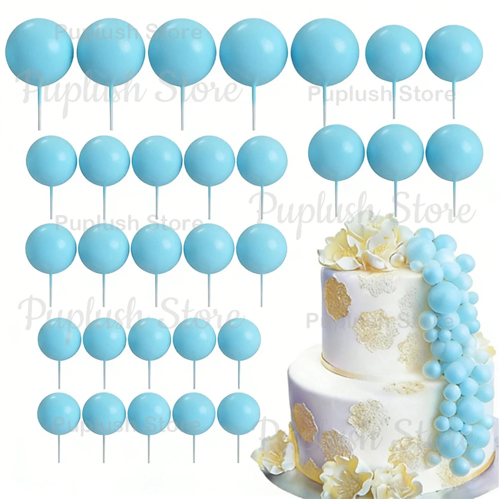 A set of light blue foam cake toppers on sticks, including various sizes and shapes.