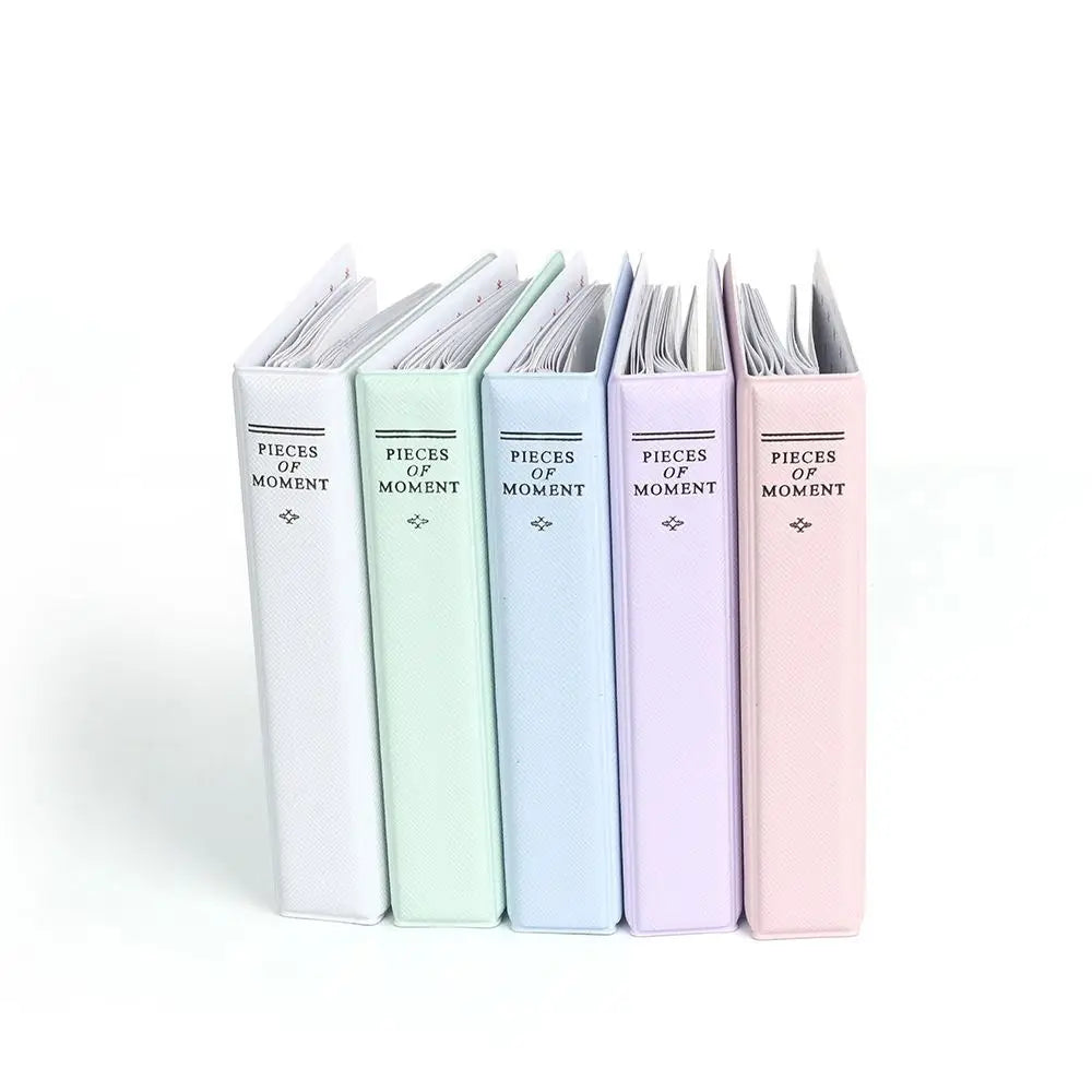 A set of 10 pastel colored photo albums with the text Pieces of Moment