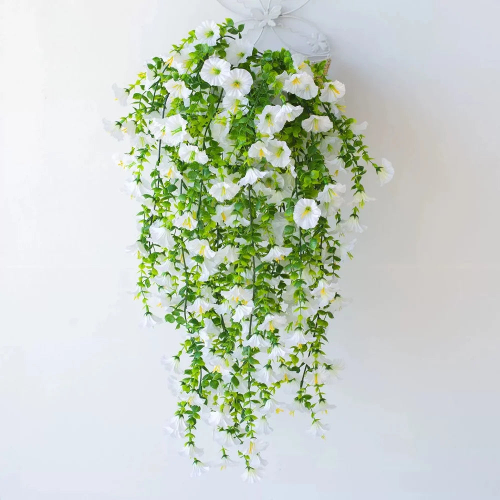A lush green and white artificial morning glory hanging vine arrangement