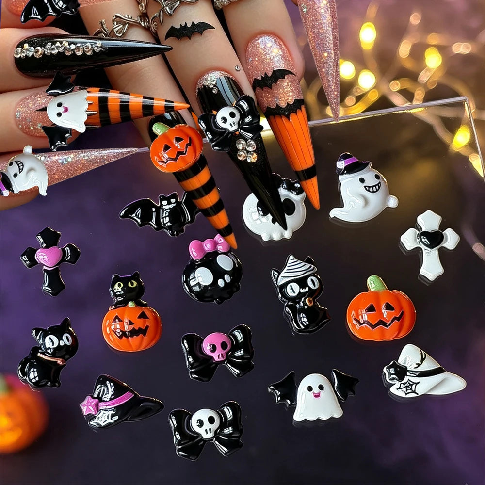 A variety pack of black and white Halloween resin nail charms featuring skulls, bats, pumpkins, and other spooky designs.