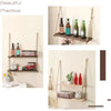A rustic floating wooden storage shelf displaying various glass bottles and decorative items.