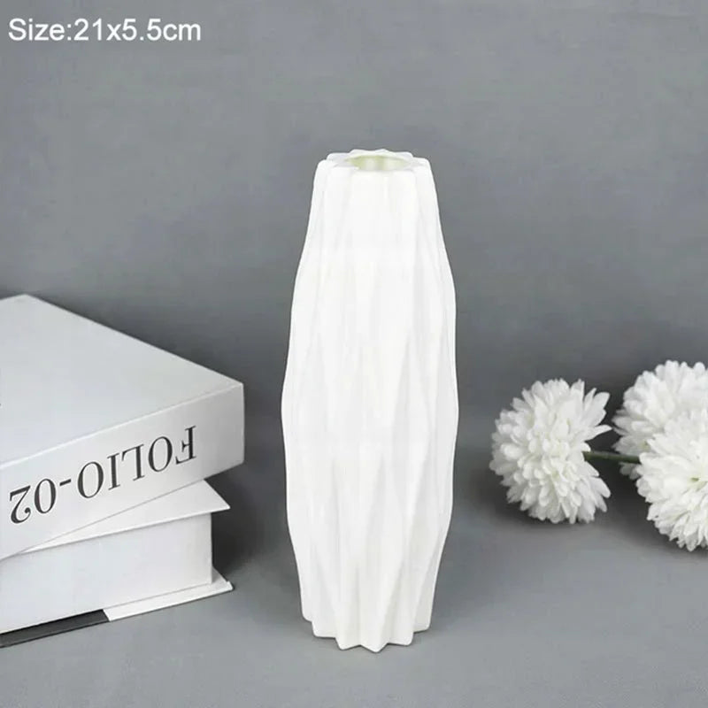 A tall, white, Nordic style decorative plastic vase is shown against a gray background.