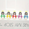 Five mini resin statues of the Virgin Mary with yellow halos and green, yellow, red, purple, and blue robes.