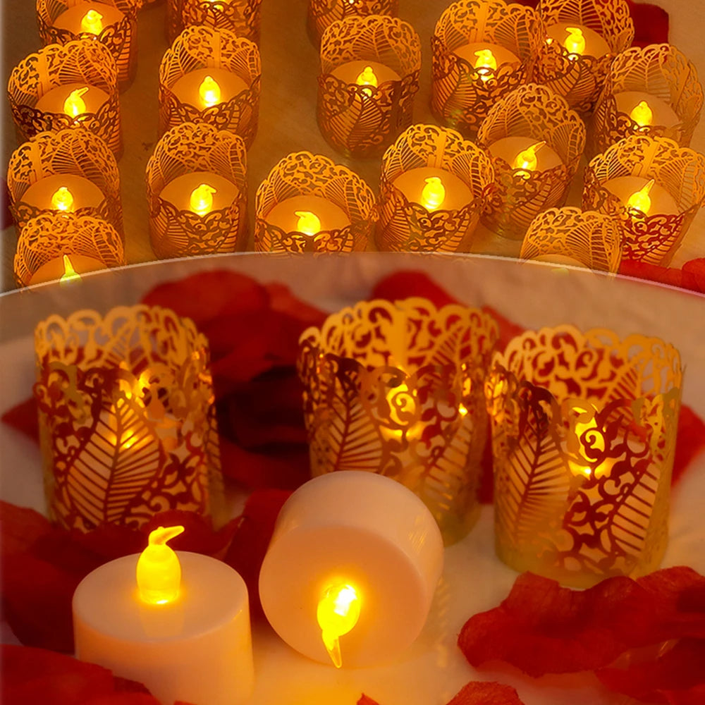 A close-up of numerous glowing orange and yellow paper lampshade tea light candles arranged on a plate with red fruit.