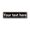 A rectangular, distressed vintage tin sign with the text Your text here on a dark background.