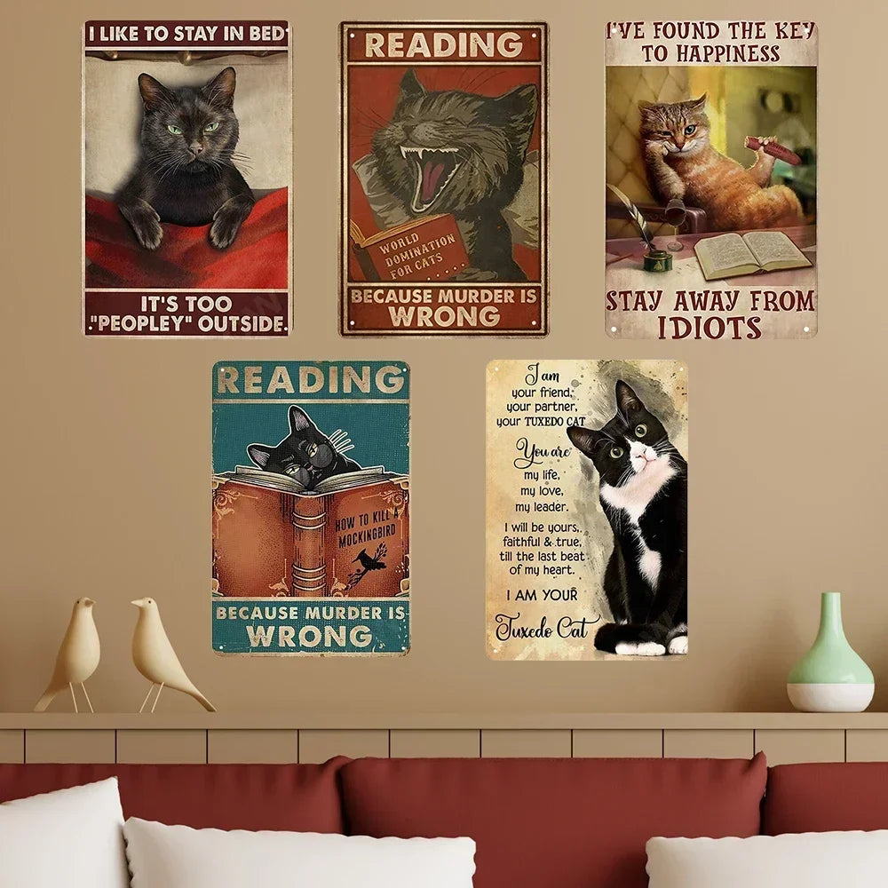 A collection of vintage metal signs featuring funny quotes about cats and reading.