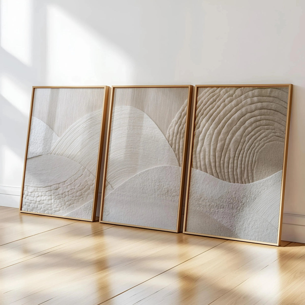 A set of three framed abstract canvas prints featuring beige textured mountain lines on a white background.