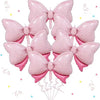 A pack of six pink, polka-dotted bow balloons used for party decorations.