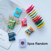 A collection of 5 random candy-shaped refrigerator magnets in various colors and shapes.