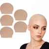 A model is shown with several realistic latex bald caps of varying sizes laid out next to her head.