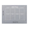 A grey magnetic acrylic weekly planner board with labeled days and sections for notes.