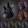A vintage vinyl record guitar wall clock displayed in various lighting and angles against a brick background.