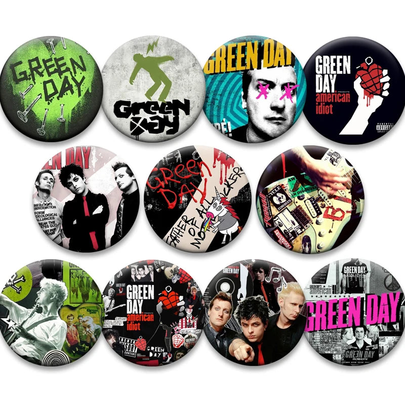 A set of collectible button pins featuring various designs and artwork related to the band Green Day.