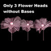 Three large pink velvet mesh flower heads without bases for wedding decoration.