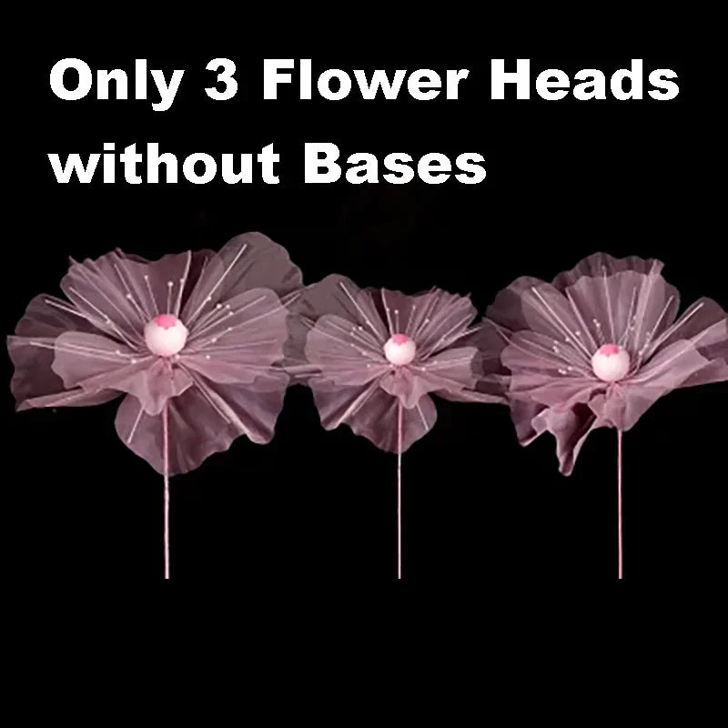 Three large pink velvet mesh flower heads without bases for wedding decoration.