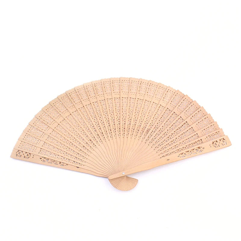 Hand carved bamboo folding fan in a light beige color shown from below