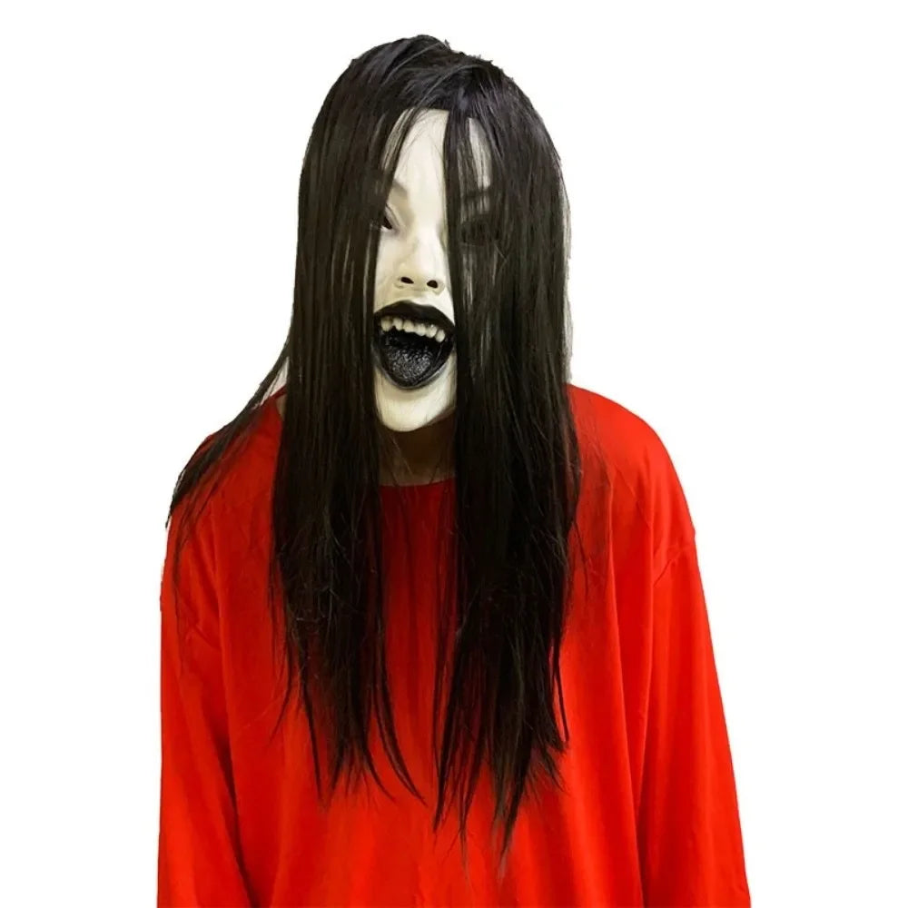 A realistic latex horror mask with long black hair wearing a red shirt.