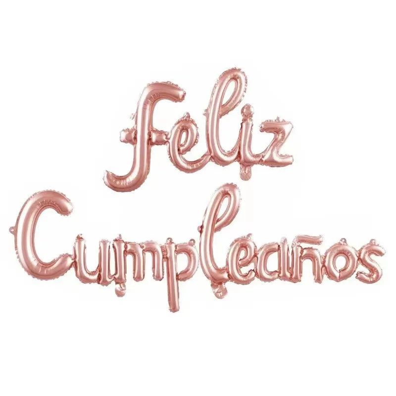 A set of metallic rose gold foil letters spelling Feliz Cumpleaños