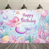 A vibrant mermaid tail birthday backdrop featuring pink and purple scales, sea flora, and bubbles against a blue background.