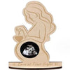 A wooden silhouette of a woman holding a heart and an ultrasound image, labeled Love at First Sight.