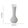 White ceramic desktop vase with an organic ripple design, measuring 4.3cm in diameter and 20.0cm in height.