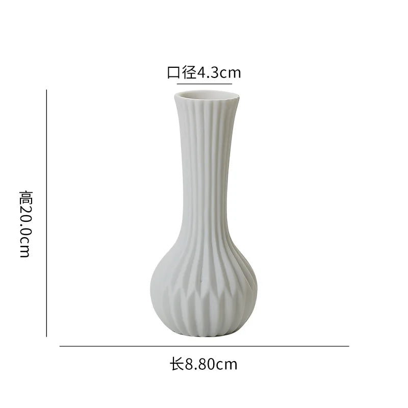 White ceramic desktop vase with an organic ripple design, measuring 4.3cm in diameter and 20.0cm in height.
