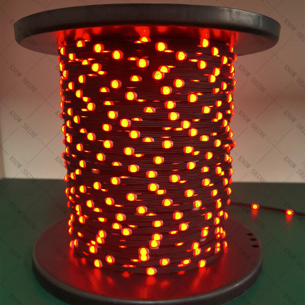 A close-up of a cylindrical string of red addressable LED lights glowing brightly.