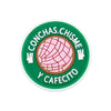 Green circular charm with pink texture and text in Spanish: CONCHAS CHISME Y CAFECITO
