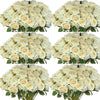 A collection of artificial silk roses in various shades of cream and white arranged for table decor.
