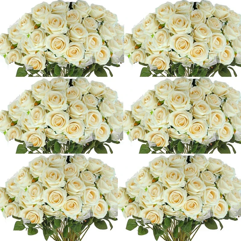 A collection of artificial silk roses in various shades of cream and white arranged for table decor.