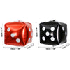 A pair of foil balloons shaped like dice, one red and one black, used for Las Vegas party decor.
