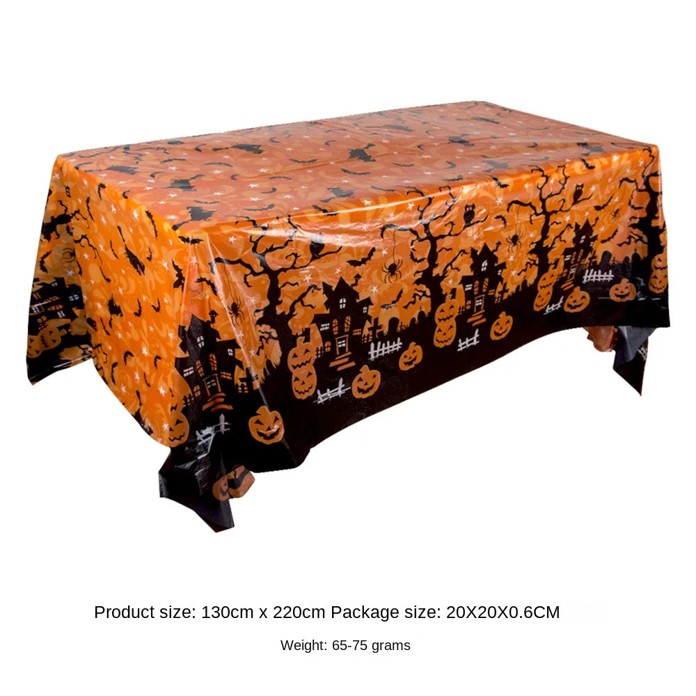 Orange Halloween tablecloth featuring a pattern of pumpkins, spider webs, and bats.