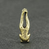 Vintage brass monkey key chain charm with an elongated, stylized monkey figure.