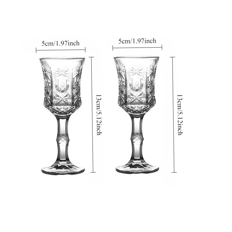 A pair of vintage French-style high-footed wine glasses shown with dimensions.