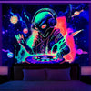 A vibrant neon-colored tapestry featuring a stylized alien head with glowing eyes against a dark cosmic background.