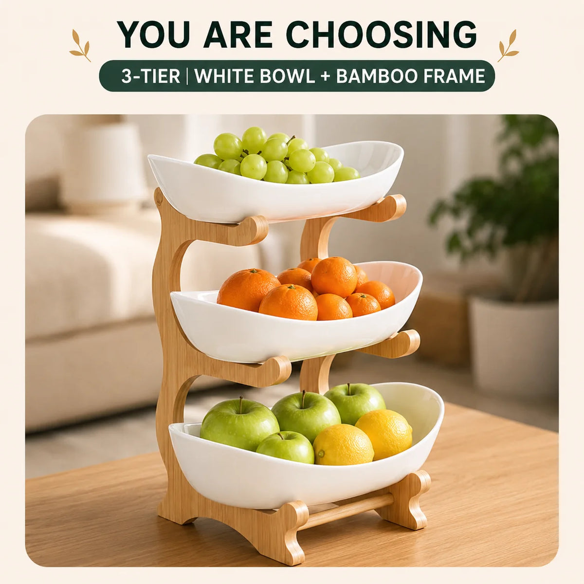 A wooden 3-tier fruit basket stand holding green grapes, oranges, and green apples.