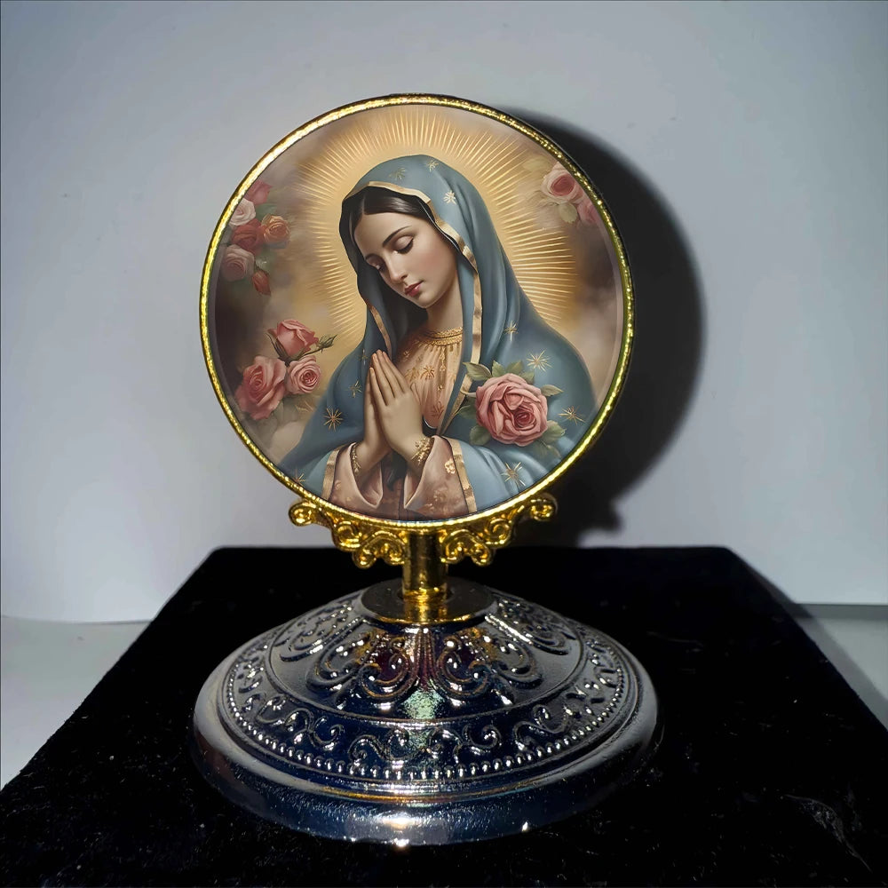 A golden-rimmed circular ornament featuring a depiction of the Virgin Mary with a halo and roses.