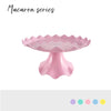 Pink plastic macaron series cake stand with ruffled edges