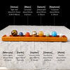 A collection of natural crystal balls representing the solar system planets arranged in a row.