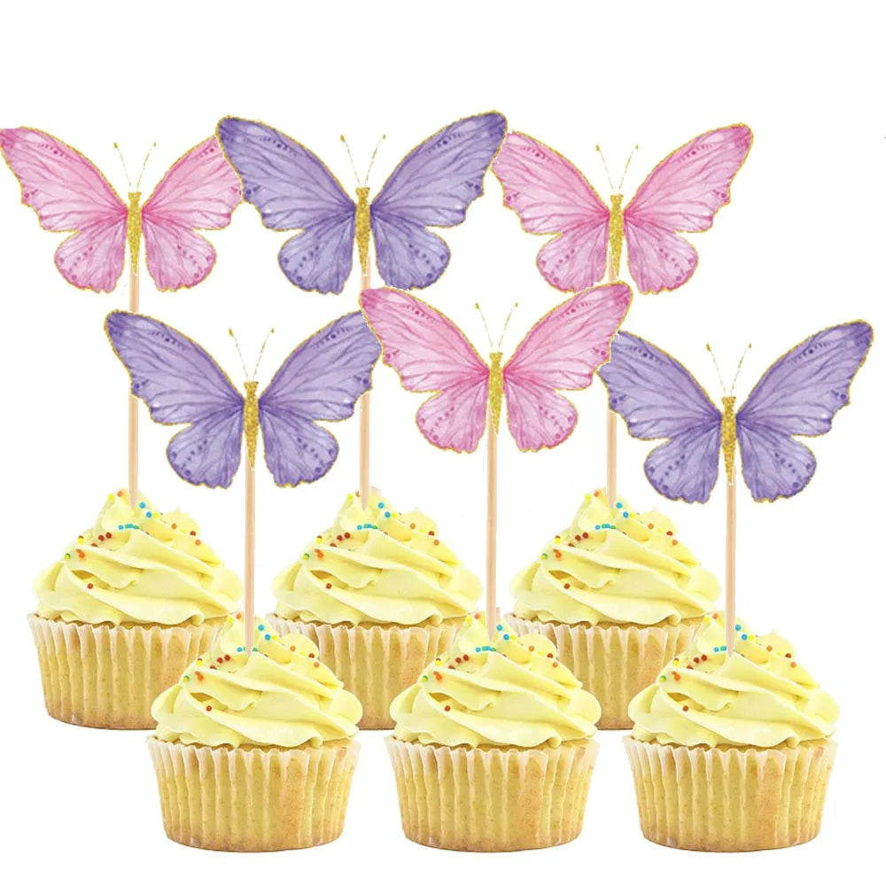 A set of butterfly-shaped cake toppers in pink and purple colors displayed above cupcakes.