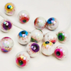 Un set de dix perles de séparation pour yeux en acrylique iridescent, de différentes couleurs et finitions.