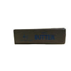 Jouet anti-stress rectangulaire marron, étiqueté 4oz/113g de beurre net