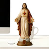 A religious figurine set depicting Jesus and the Blessed Mother, with Jesus holding a heart.