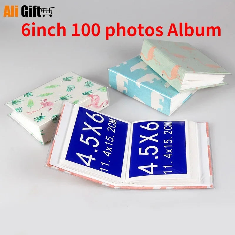 A set of 6 inch photo albums, including a 100 photo album and a 4.5x6 inch album with blue covers.