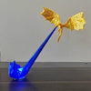 A blue dragon flame light fixture with golden wings and a long, slender body.