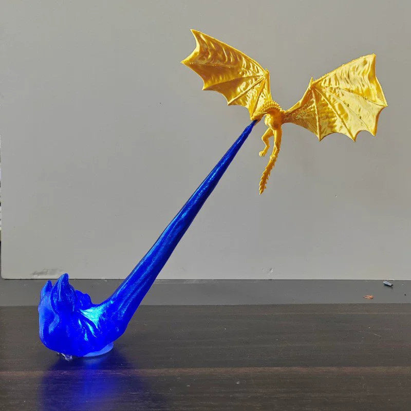 A blue dragon flame light fixture with golden wings and a long, slender body.